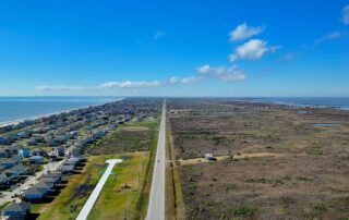 Aerial above Bolivar Penisnula Looking At Crystal Beach Texas