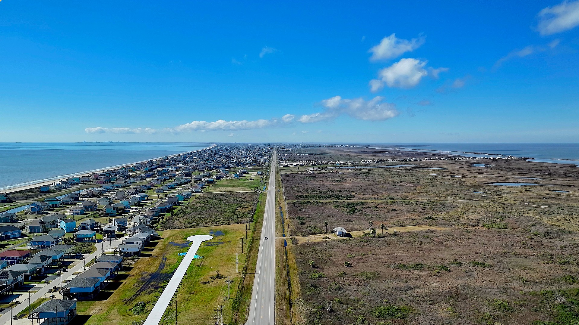 Aerial above Bolivar Penisnula Looking At Crystal Beach Texas