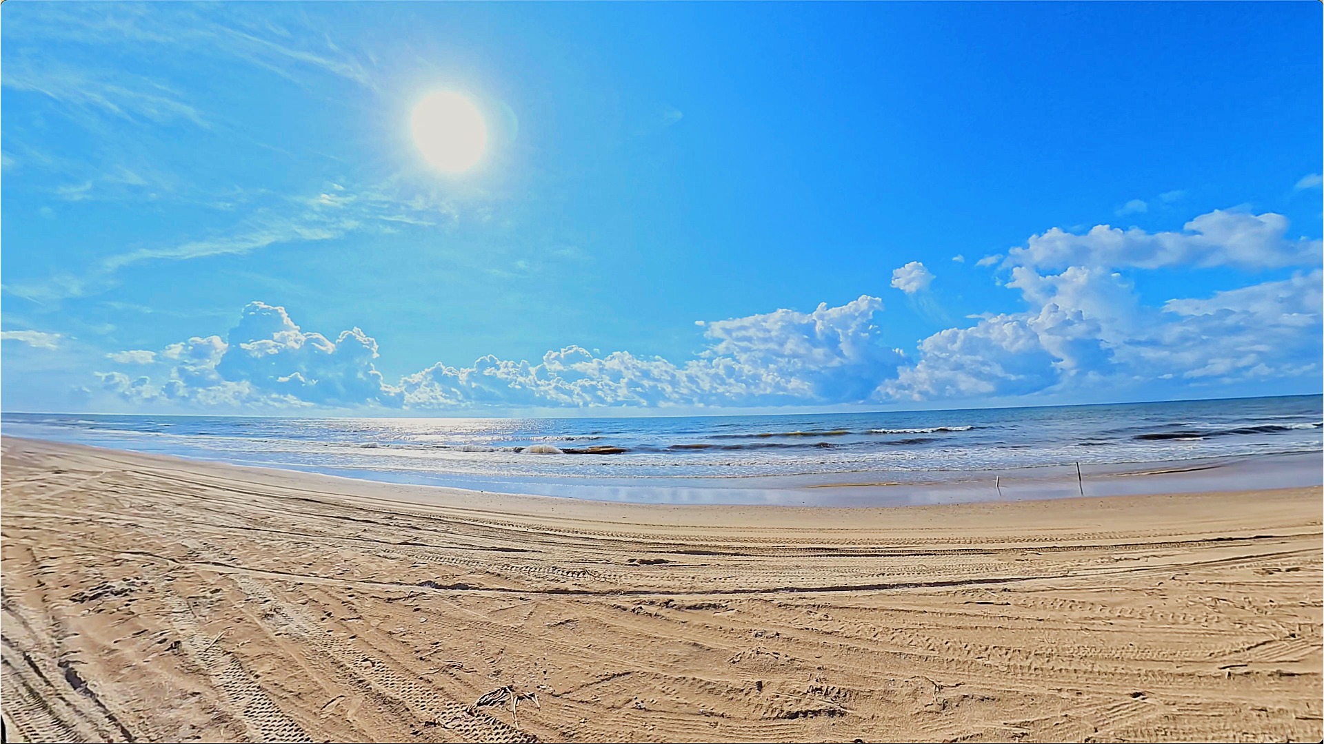 Beachfront sunny day at surfs edge