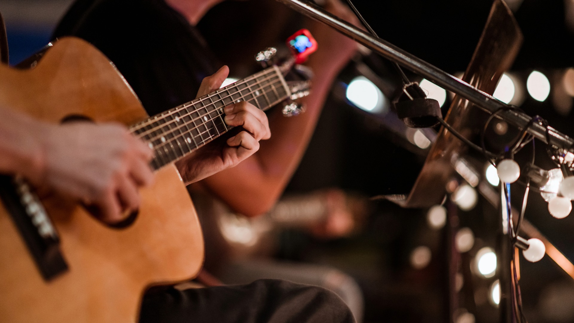 Close Up Of Guitar In Hand