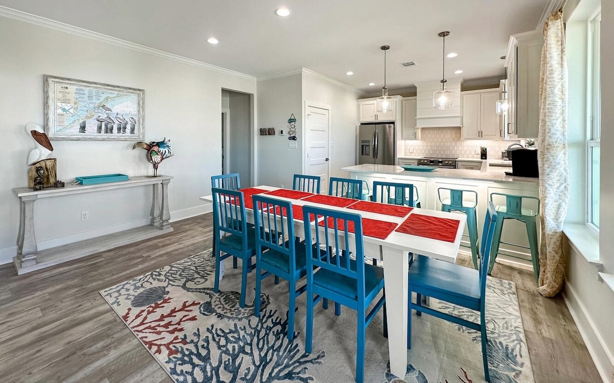 Dining table with kitchen in the background