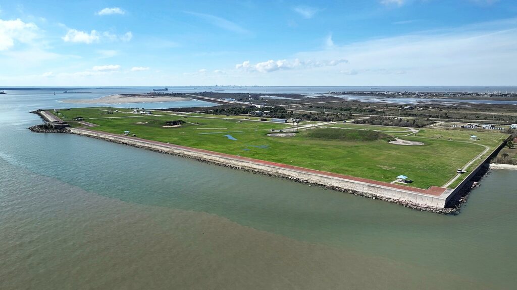 Aerial Of Fort Travis With Lighthouse On Background